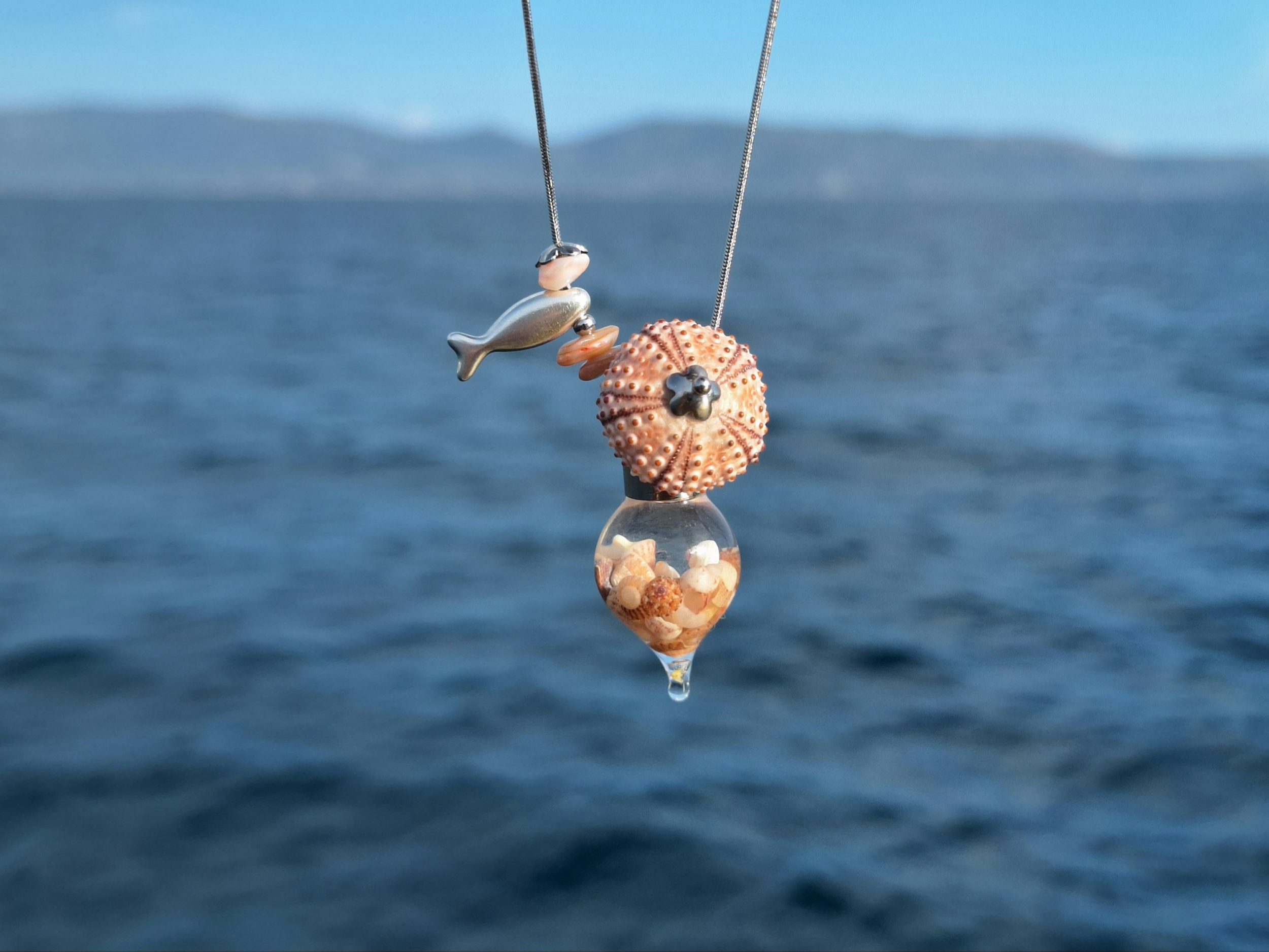 Collier Calypso, oursin rose et coquillages mini